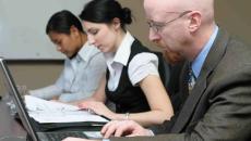 Group of workers with laptops