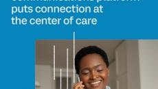 Healthcare worker talking on the phone and looking at pack of pills Healthcare worker talking on the phone and looking at pack of pills