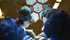 Two surgeons operating