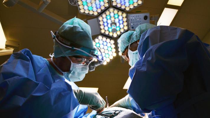 Two surgeons operating