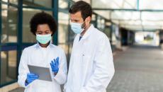 doctors looking at a tablet