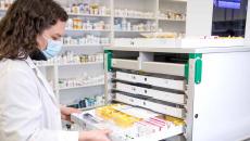 Pharmacist sorting pills Pharmacist sorting pills