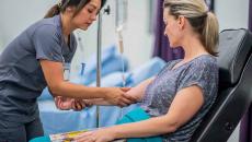 Nurse prepping a patient for IV insertion Nurse prepping a patient for IV insertion