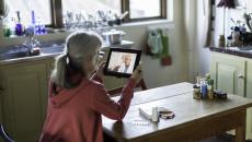 Patient attending telehealth appointment on tablet