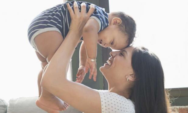 Parent holding baby Parent holding baby