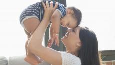 Parent holding baby Parent holding baby