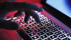 hand on backlit laptop keyboard