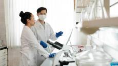 Medical researchers on a computer