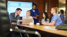 Healthcare workers meeting with business people Healthcare workers meeting with business people