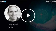 Mika Newton, xCures_Doctor's hand holding brain with AI chip Photo by Marco Marca/iStock/Getty Images Plus