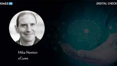 Mika Newton, xCures_Doctor's hand holding brain with AI chip Photo by Marco Marca/iStock/Getty Images Plus