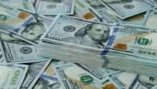 Stack of $100 U.S. dollars on loose bills