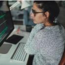 Person looking at code on a computer screen