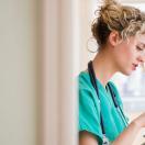 A nurse holding a digital tablet to check a patient's file A nurse holding a digital tablet to check a patient's file