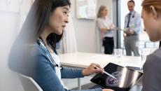 Doctors reviewing a patient's brain scan