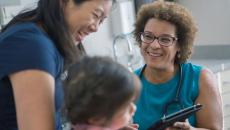 Doctor speaks with mother and child