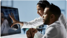 Healthcare workers looking at screen Healthcare workers looking at screen