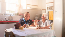 Aged care nurse conversing with a resident Aged care nurse conversing with a resident